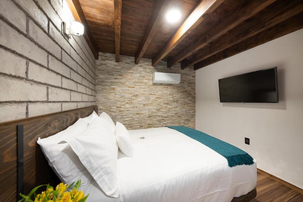 Postel nebo postele na pokoji v ubytování Matian Hotel Boutique