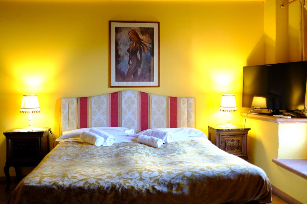 Postel nebo postele na pokoji v ubytování Al Tuscany