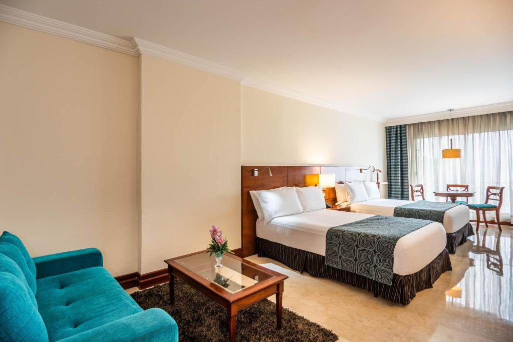 Una cama o camas en una habitación de Hotel Dann Carlton Bucaramanga