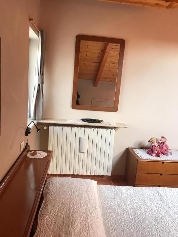 A bed or beds in a room at Mansarda Margherita