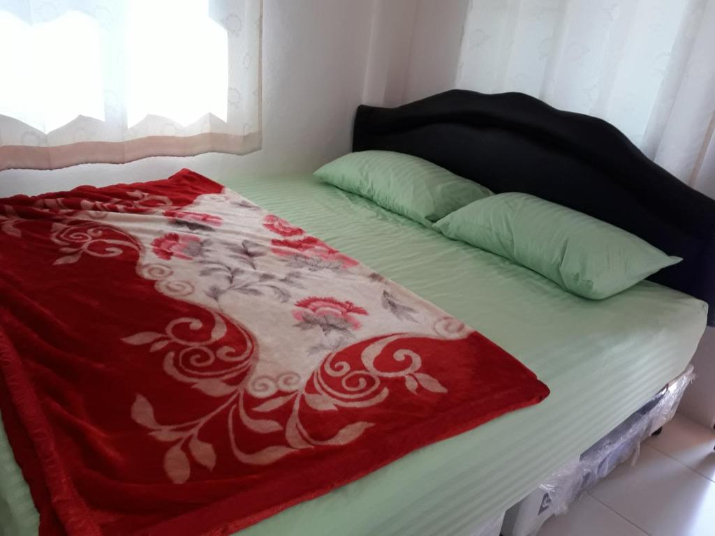 Postel nebo postele na pokoji v ubytování Panna Kalong