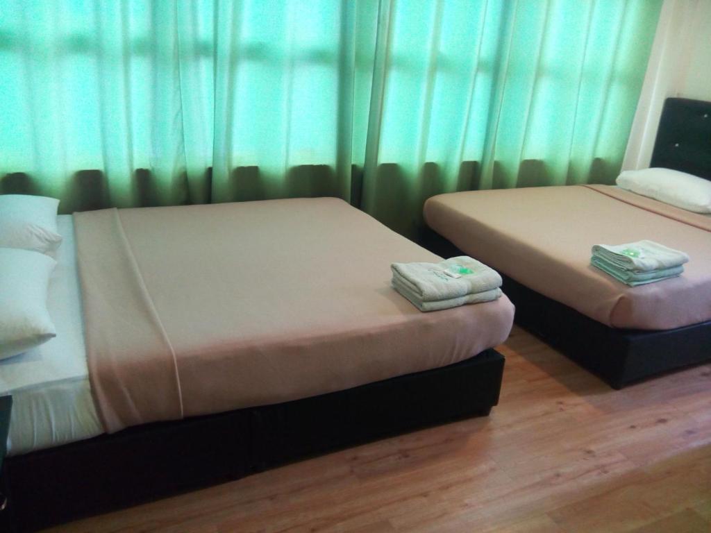 Postel nebo postele na pokoji v ubytování BINKHALED HOTEL