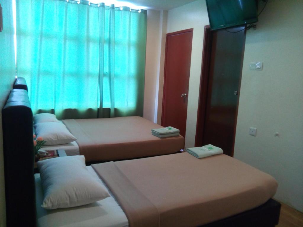 Postel nebo postele na pokoji v ubytování BINKHALED HOTEL