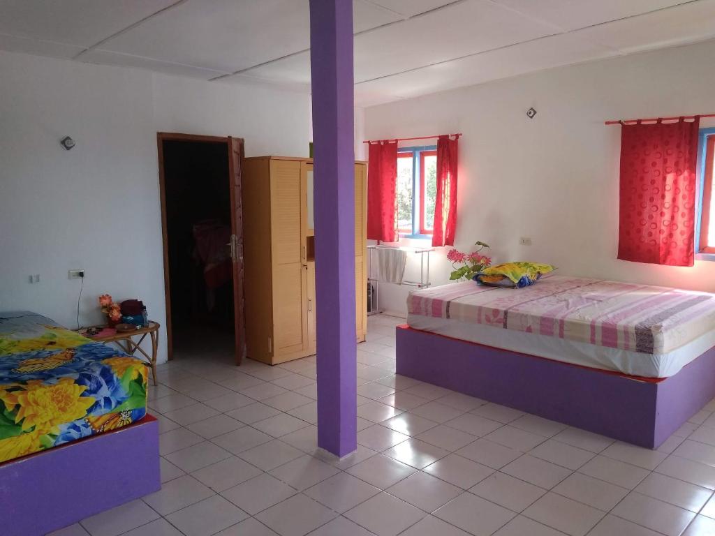 Postel nebo postele na pokoji v ubytování pulau weh sabang marifi