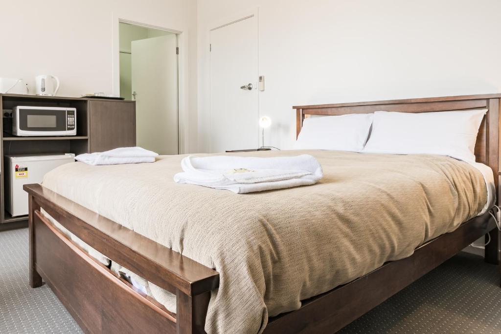 Postel nebo postele na pokoji v ubytování Somerset Hotel