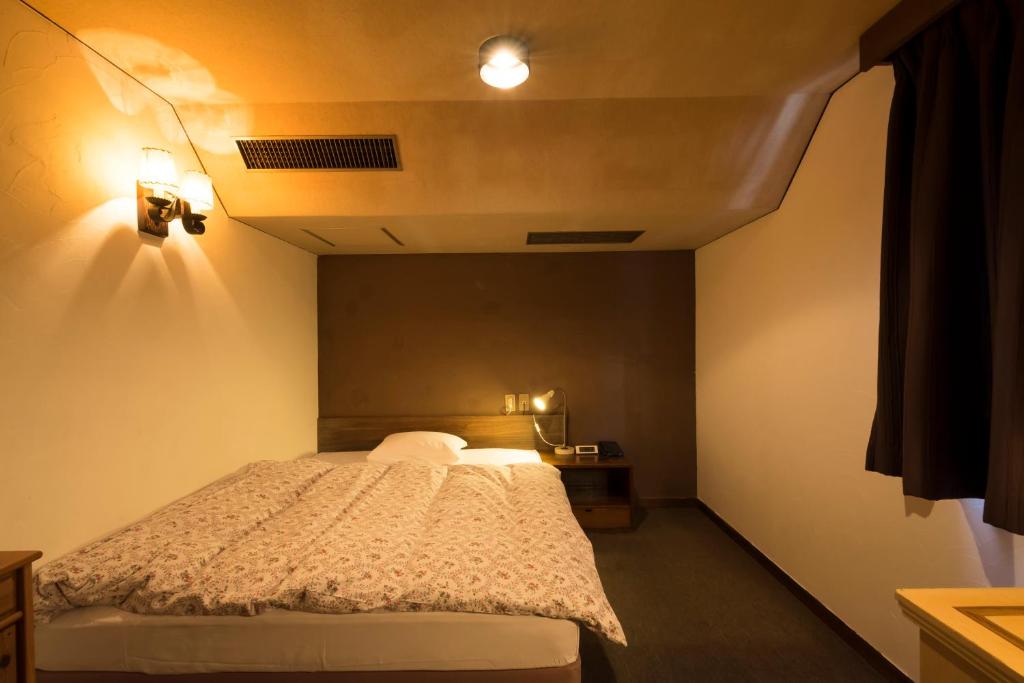 Postel nebo postele na pokoji v ubytování Hotel Haus St Anton