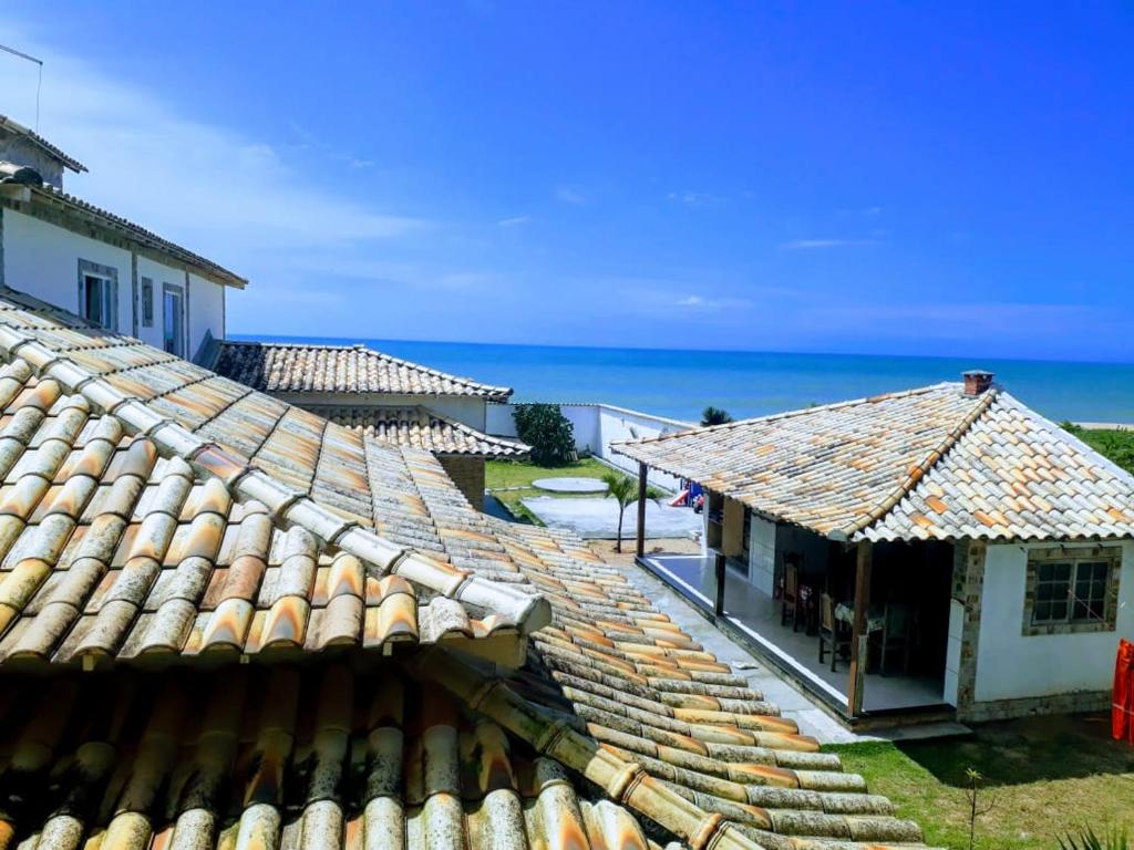 a view of the roofs of two buildings at Suítes a Beira Mar in Rio das Ostras