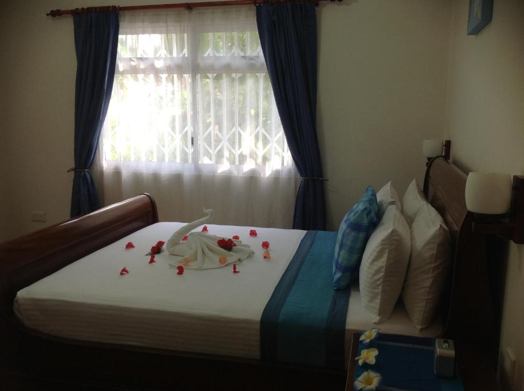 Letto o letti in una camera di Seashell Beach Villa