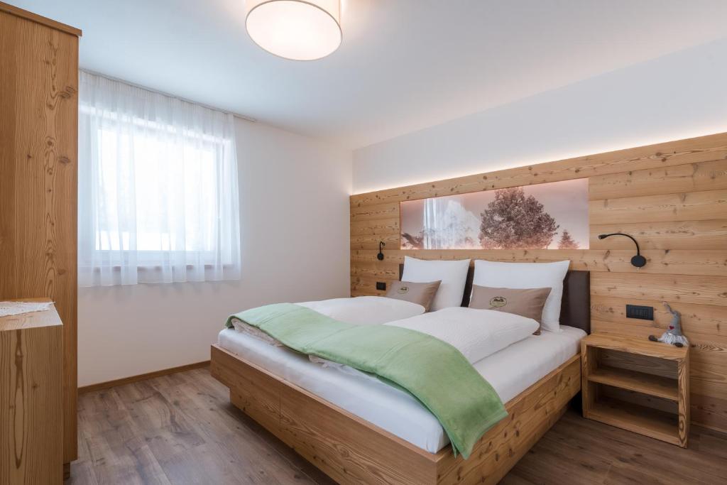 A bed or beds in a room at Les Pizades