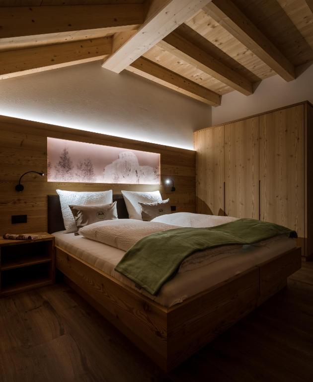 A bed or beds in a room at Les Pizades