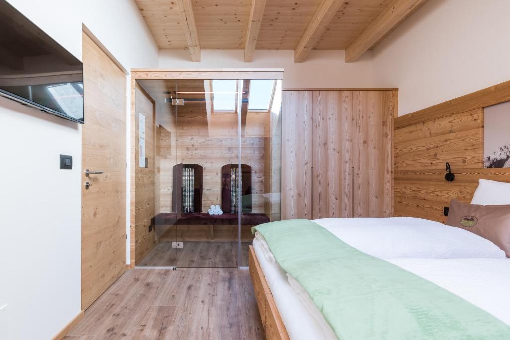 A bed or beds in a room at Les Pizades