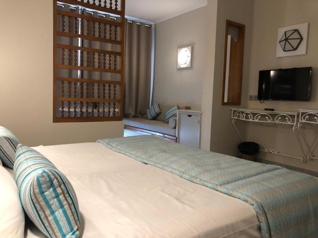 Postel nebo postele na pokoji v ubytování Hotel La Residence Hammamet