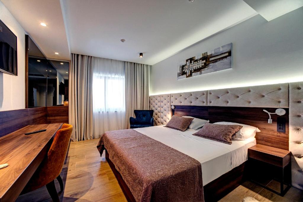 Voodi või voodid majutusasutuse Hotel Scala d'Oro toas