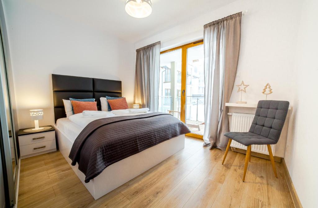 Posteľ alebo postele v izbe v ubytovaní Apartamenty Sun & Snow Sarnia Residence