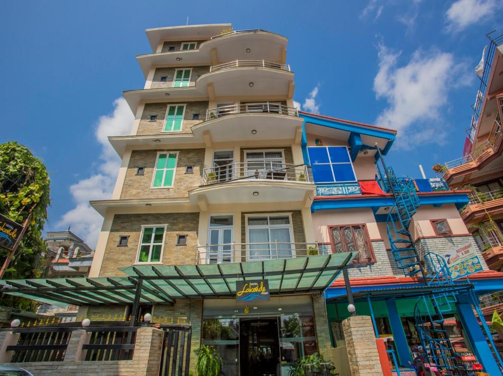 a tall building with a sign in front of it at Hotel Lakeside Pvt. Ltd. in Pokhara
