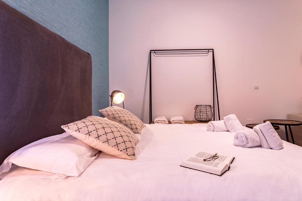 Posteľ alebo postele v izbe v ubytovaní Málaga Central Suites