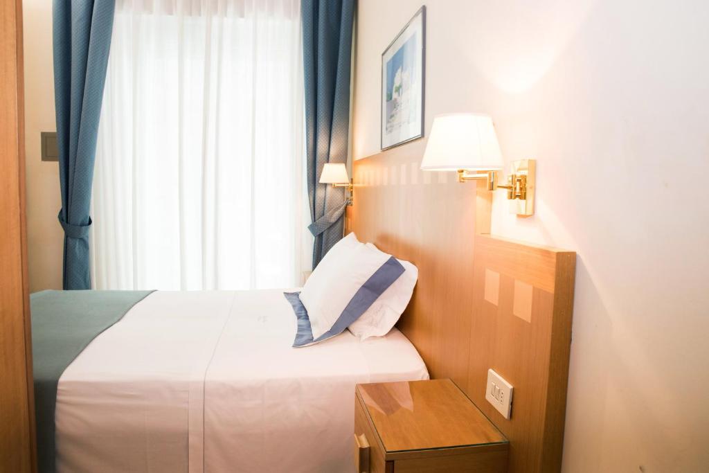 Łóżko lub łóżka w pokoju w obiekcie Hotel Parco