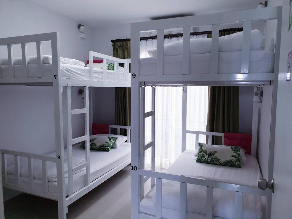 A bunk bed or bunk beds in a room at DKaYa Hostel