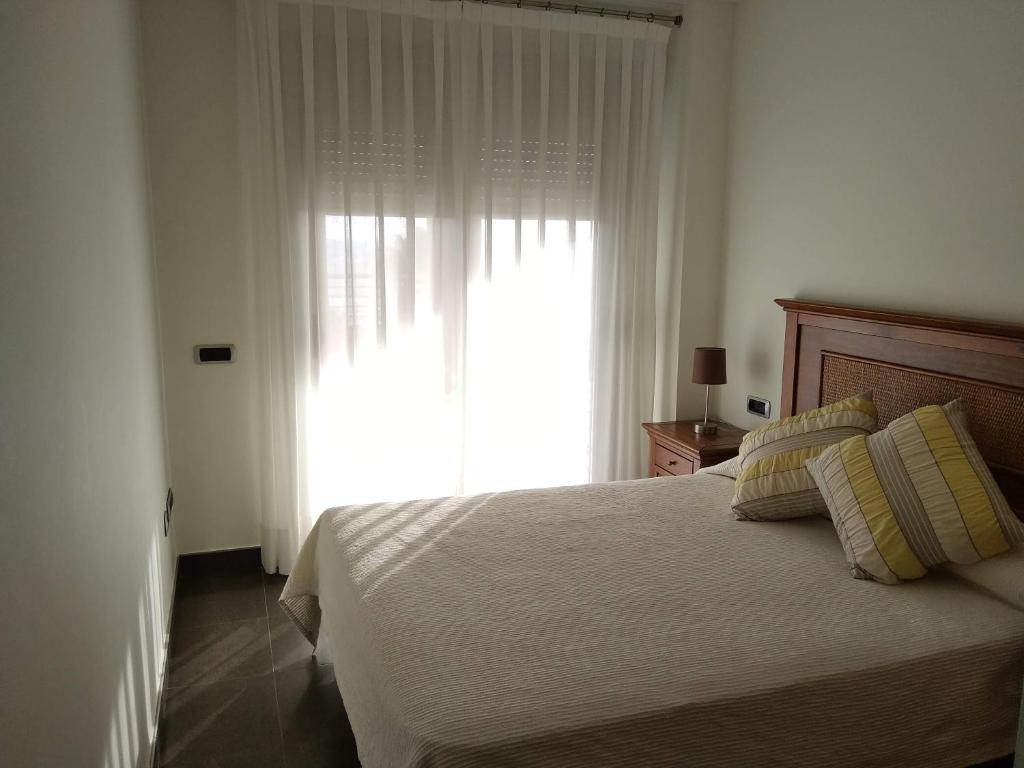 Postel nebo postele na pokoji v ubytování Apartamentos Deluxe Playa Norte