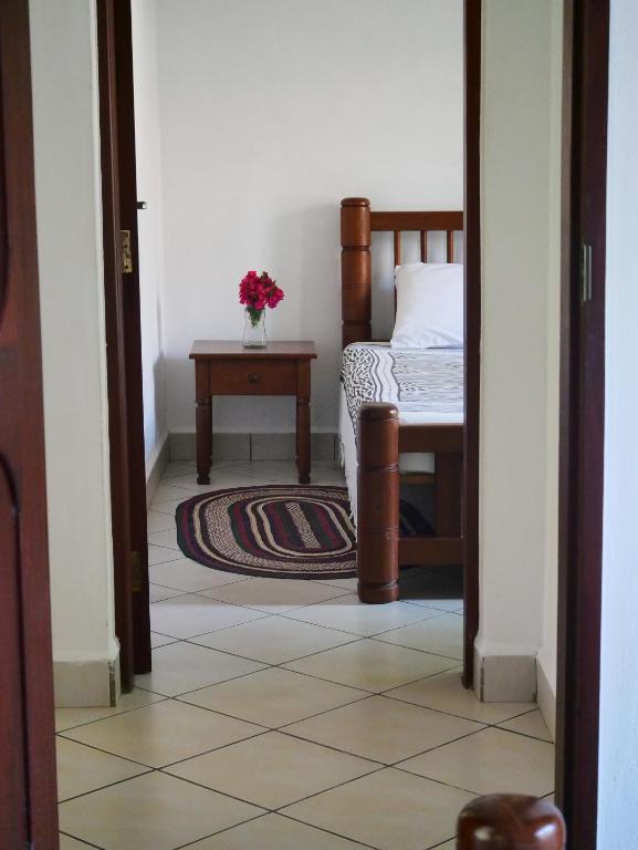 Postel nebo postele na pokoji v ubytování Diani Cottages