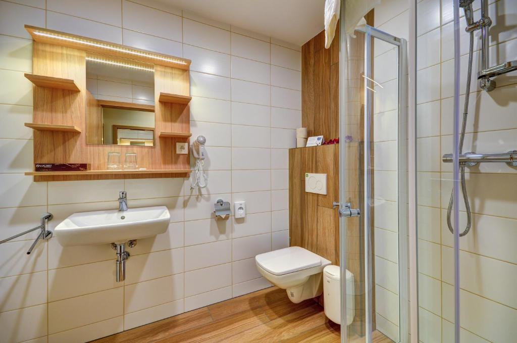 Koupelna v ubytování Hotel Helios