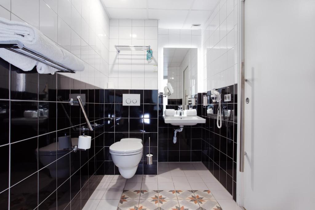 Koupelna v ubytování Hotel Albert 1er