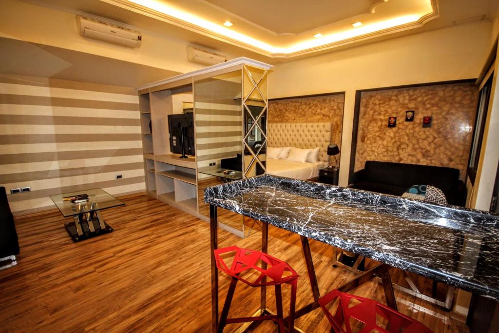 Postel nebo postele na pokoji v ubytování Cedros Inn Boutique Hotel
