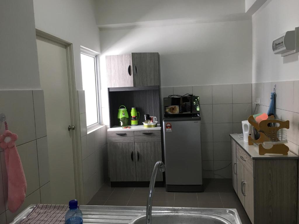 Kuchyň nebo kuchyňský kout v ubytování OHANA Sky Villa Residences