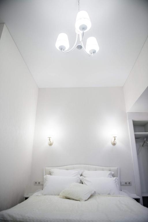 Postel nebo postele na pokoji v ubytování Apart Hotel Quartet