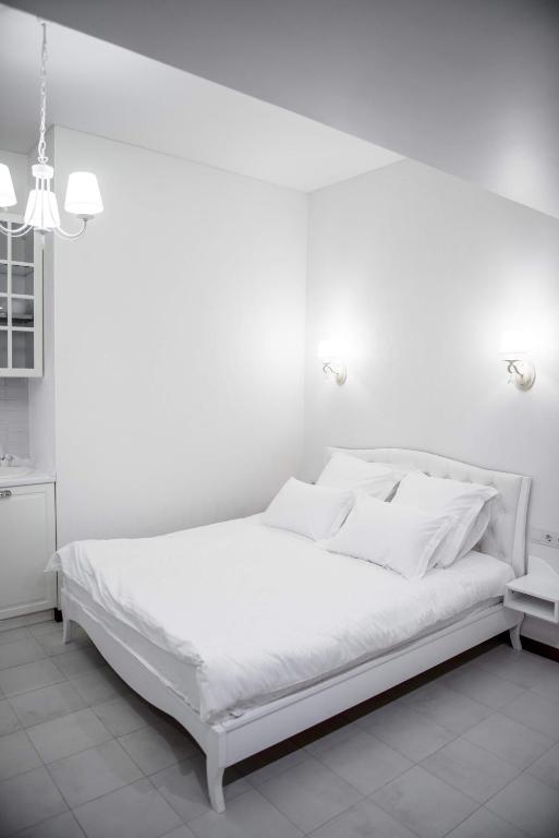 Postel nebo postele na pokoji v ubytování Apart Hotel Quartet