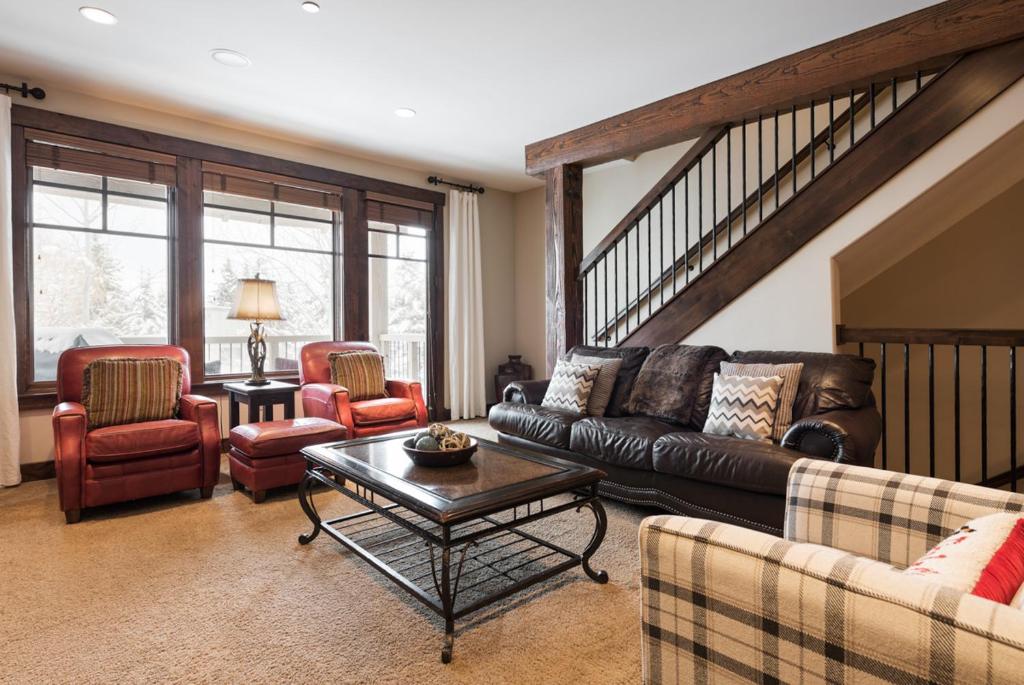 a living room with a leather couch and chairs at Silver Star #902 - 3 Bed TH in Park City