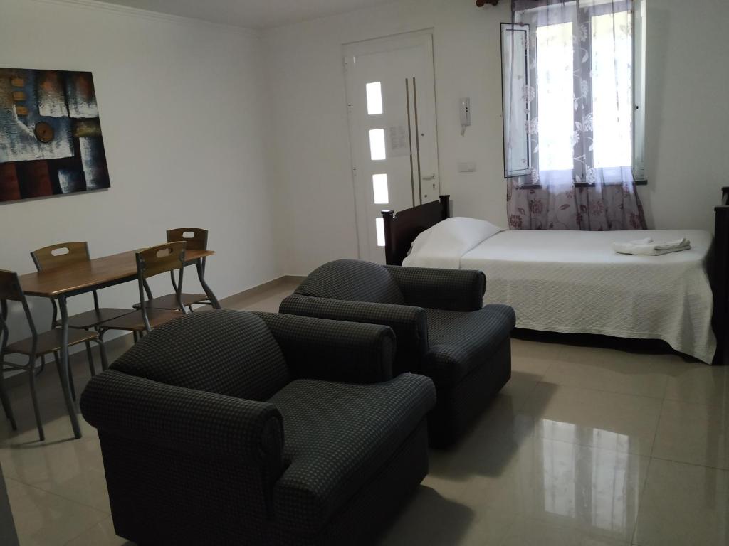 Postel nebo postele na pokoji v ubytování Costa & Isaias Apartamentos