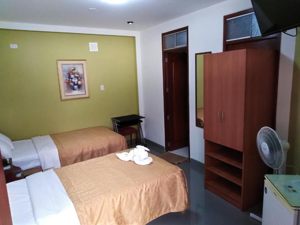 Postel nebo postele na pokoji v ubytování Hotel Plaza Bolognesi 344