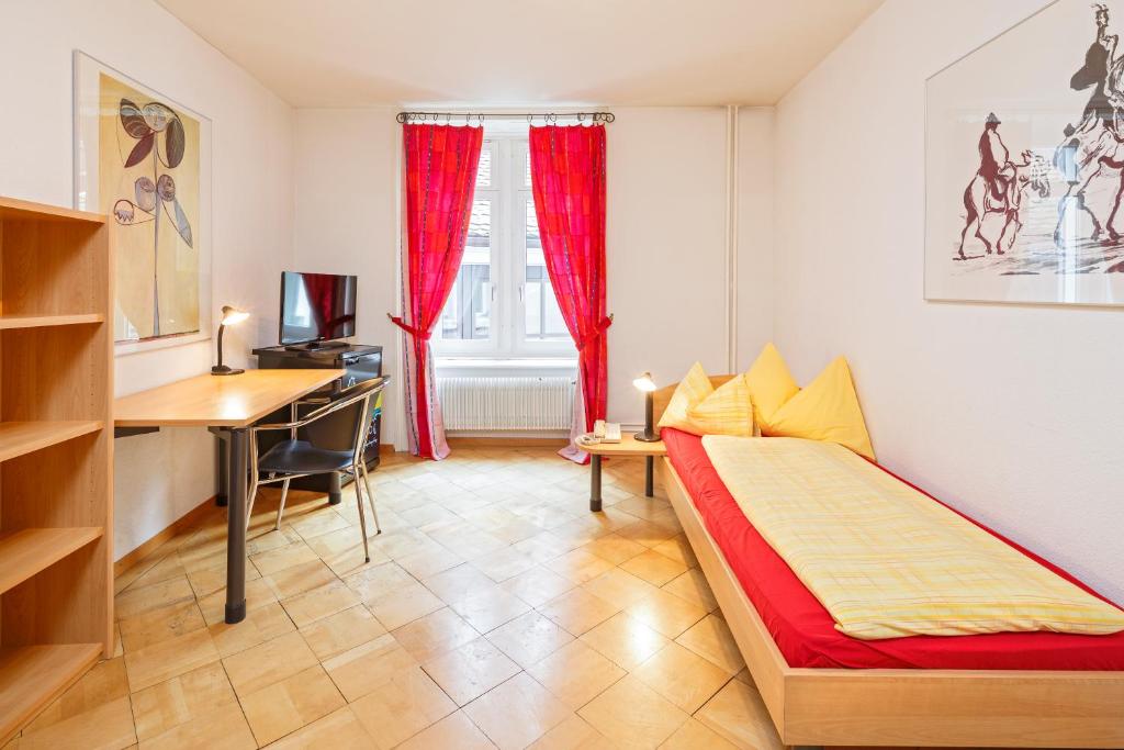 Postel nebo postele na pokoji v ubytování Residence zur Musegg