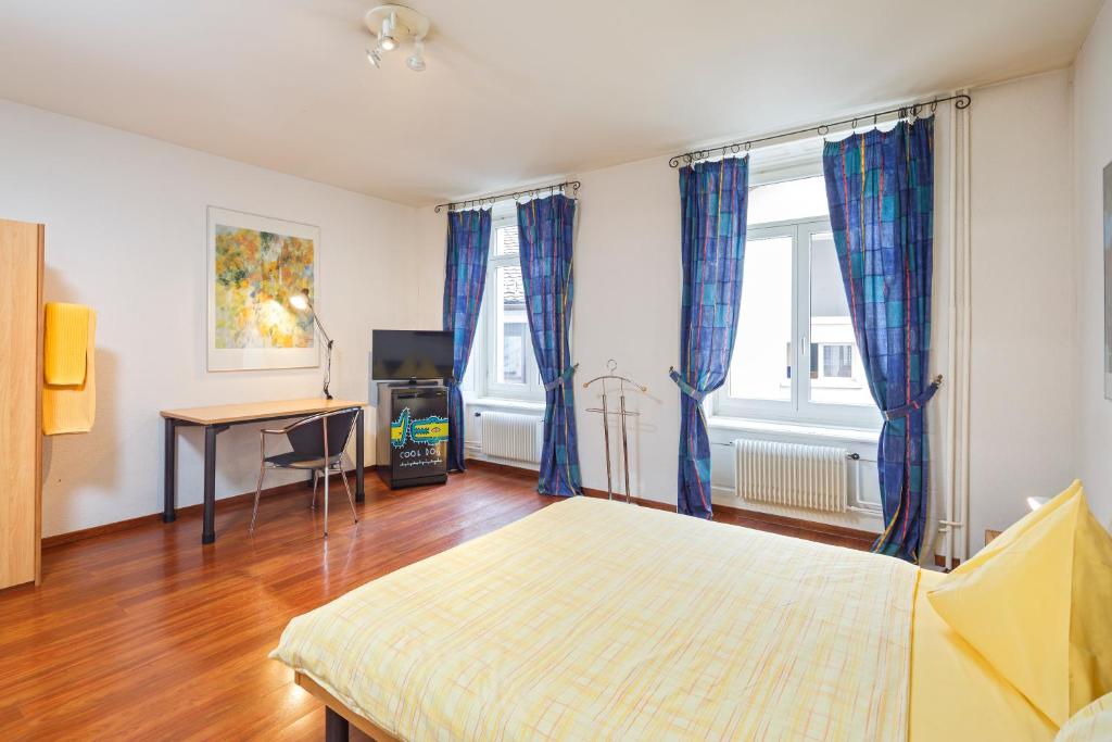 Postel nebo postele na pokoji v ubytování Residence zur Musegg