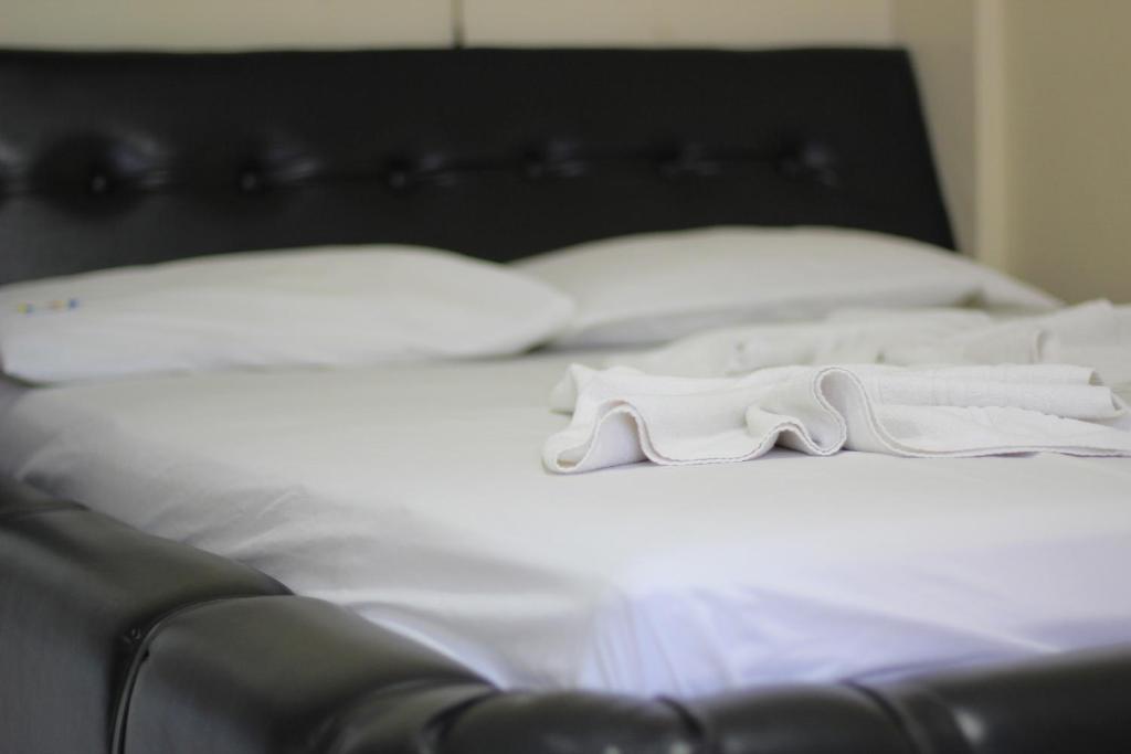 Postel nebo postele na pokoji v ubytování Hotel Pirâmide Rodoviária