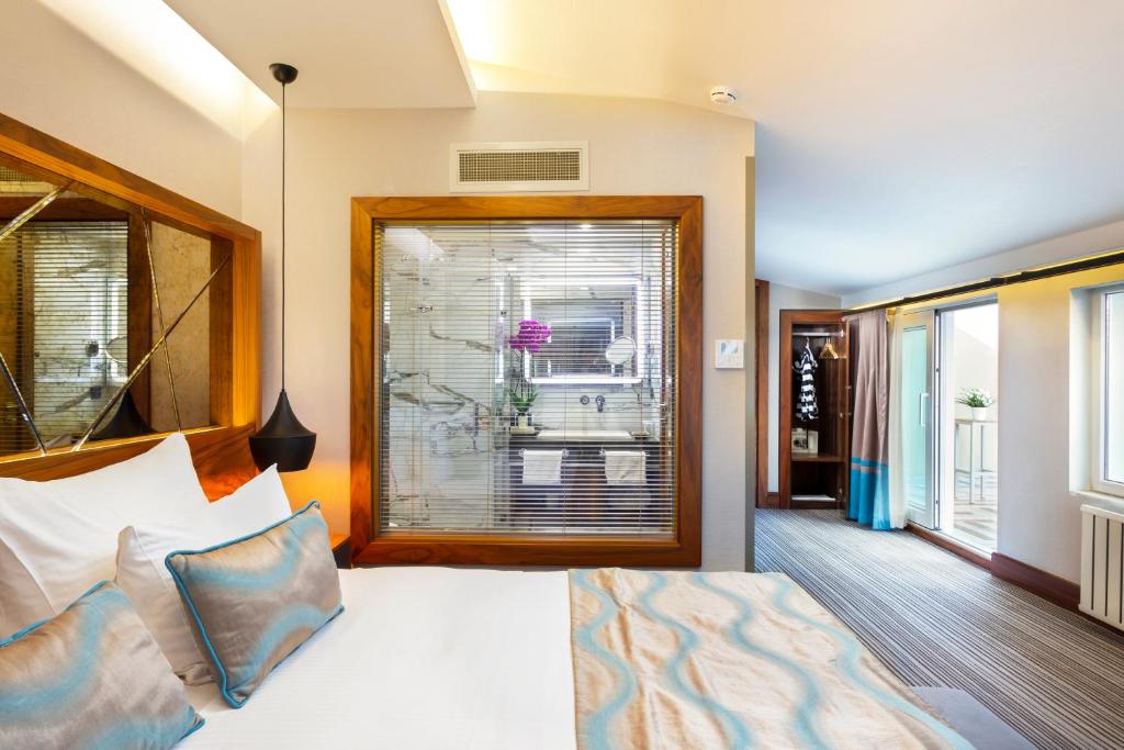 Postel nebo postele na pokoji v ubytování Artur Hotel