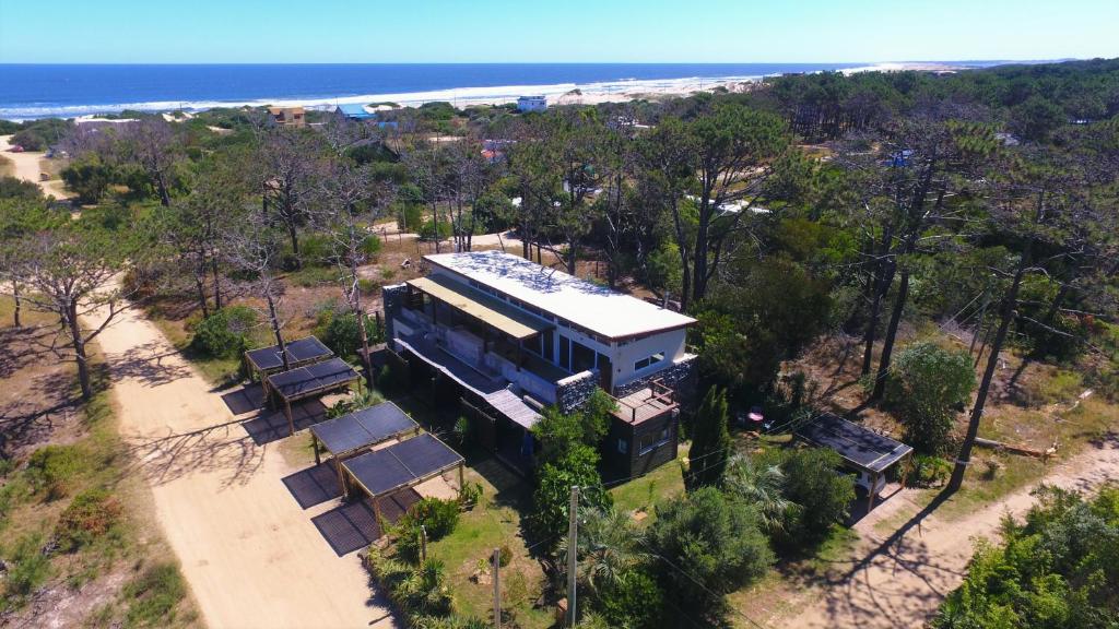 an aerial view of a house with the ocean in the background at Posada del Corumbá in La Paloma