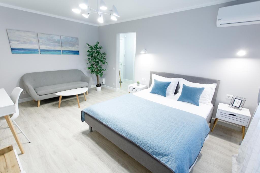 Postel nebo postele na pokoji v ubytování Apart-Hotel "LAVINA"