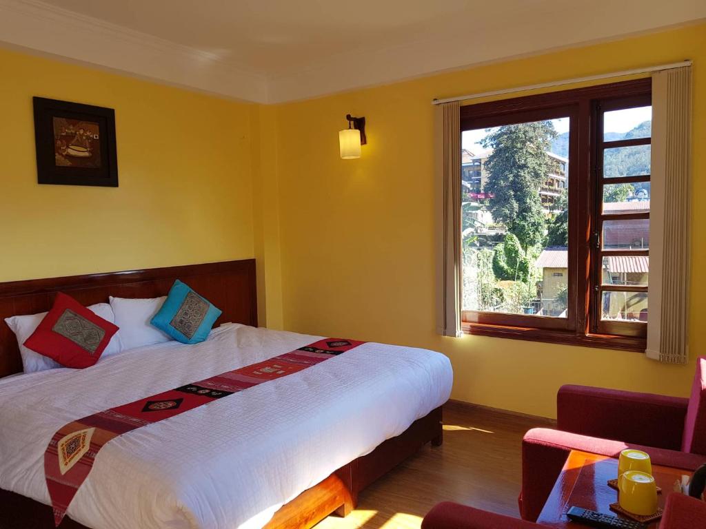 Postel nebo postele na pokoji v ubytování Anise Sapa Hotel