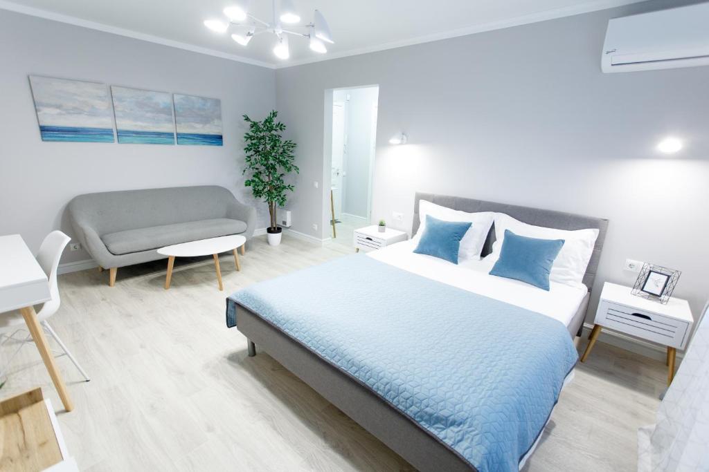 Postel nebo postele na pokoji v ubytování Apart-Hotel "LAVINA"