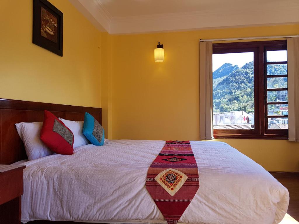 Postel nebo postele na pokoji v ubytování Anise Sapa Hotel
