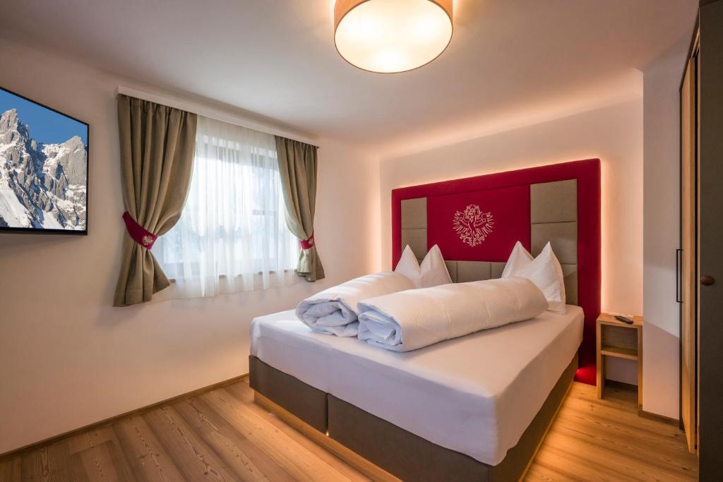 Postel nebo postele na pokoji v ubytování Kaiser Chalet