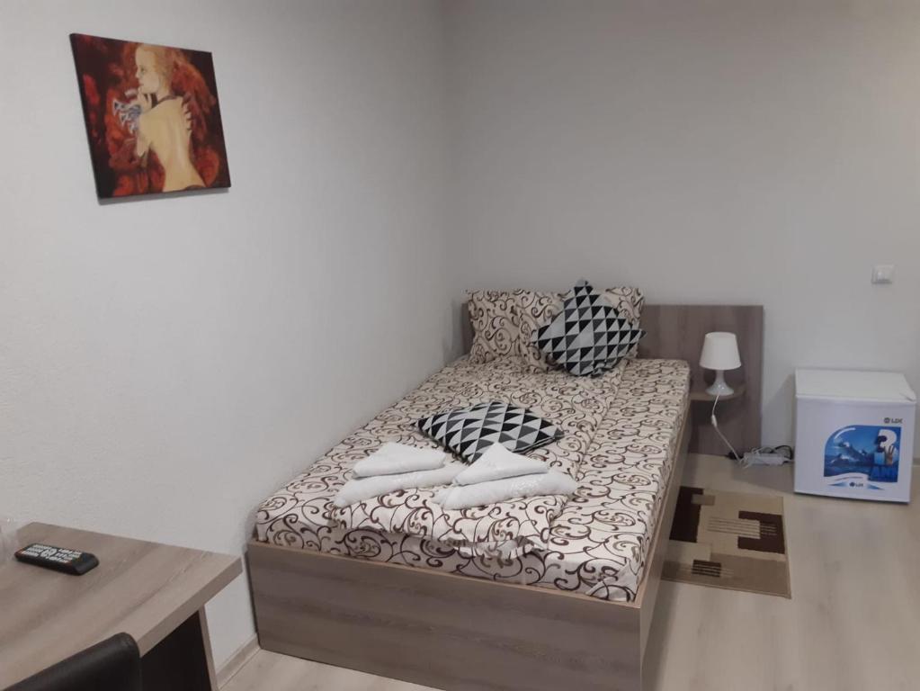 Postel nebo postele na pokoji v ubytování Pensiunea La Gagea
