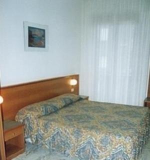 Postel nebo postele na pokoji v ubytování Hotel Valentino