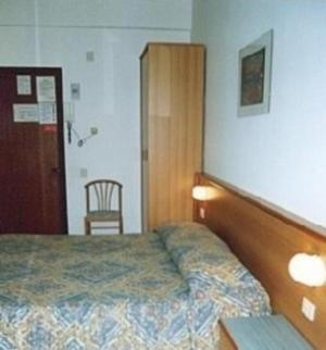 Postel nebo postele na pokoji v ubytování Hotel Valentino