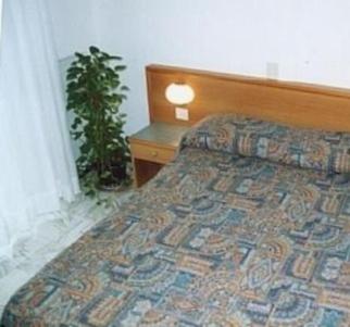 Postel nebo postele na pokoji v ubytování Hotel Valentino