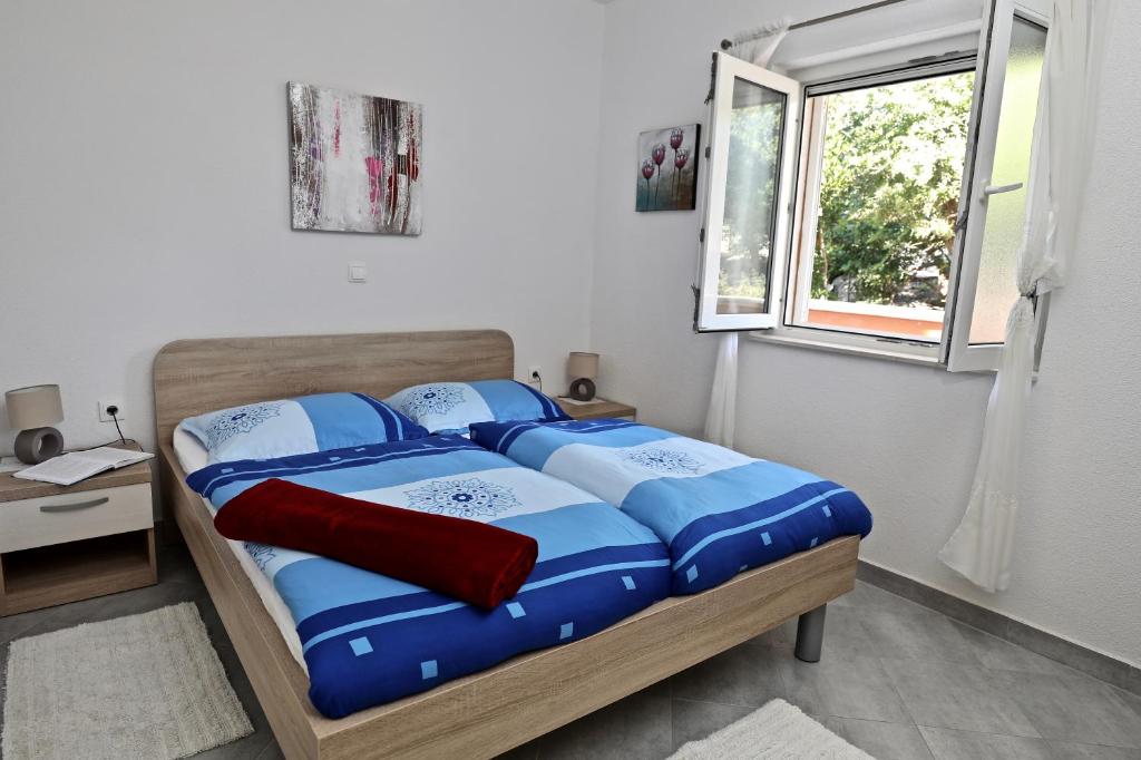 Postel nebo postele na pokoji v ubytování Apartmani Vuljan