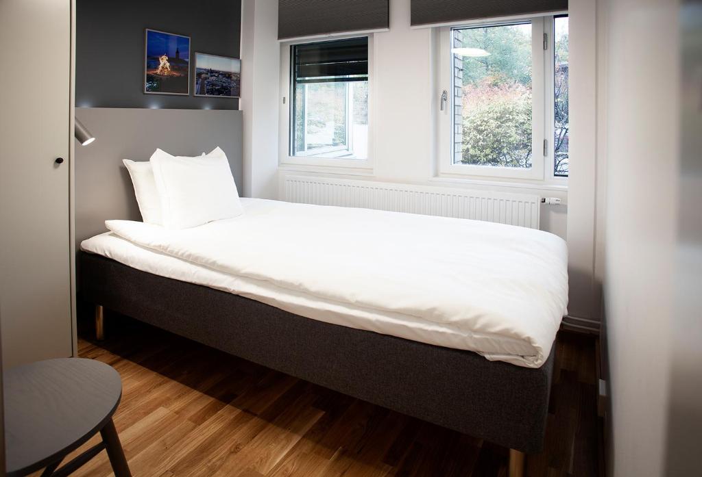 Postel nebo postele na pokoji v ubytování First Hotel The Studio