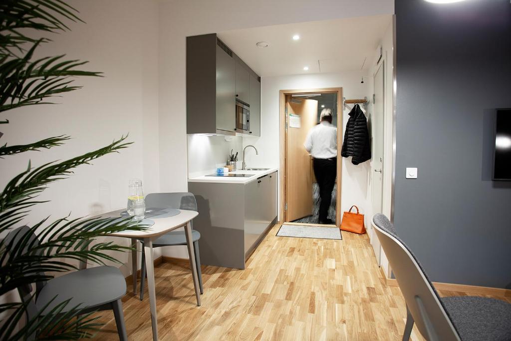 TV a/nebo společenská místnost v ubytování First Hotel The Studio